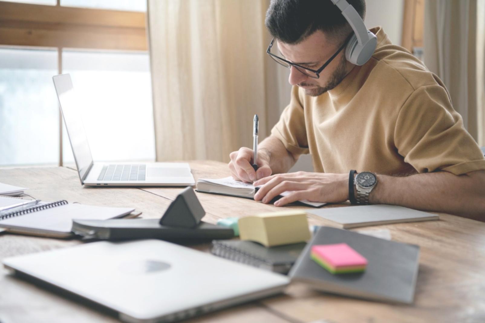 Small business owner reviewing financial documents and planning budget allocations